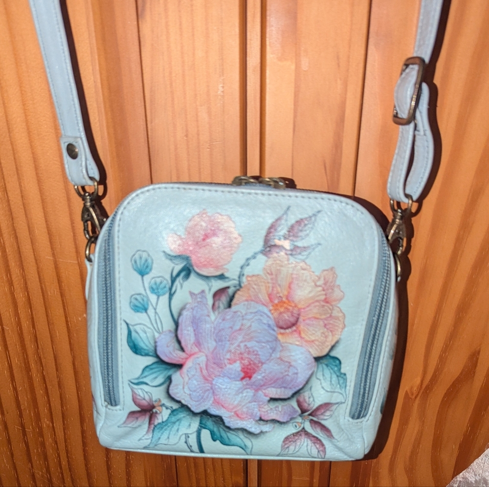 Anuschka zip around travel organizer crossbody bag.